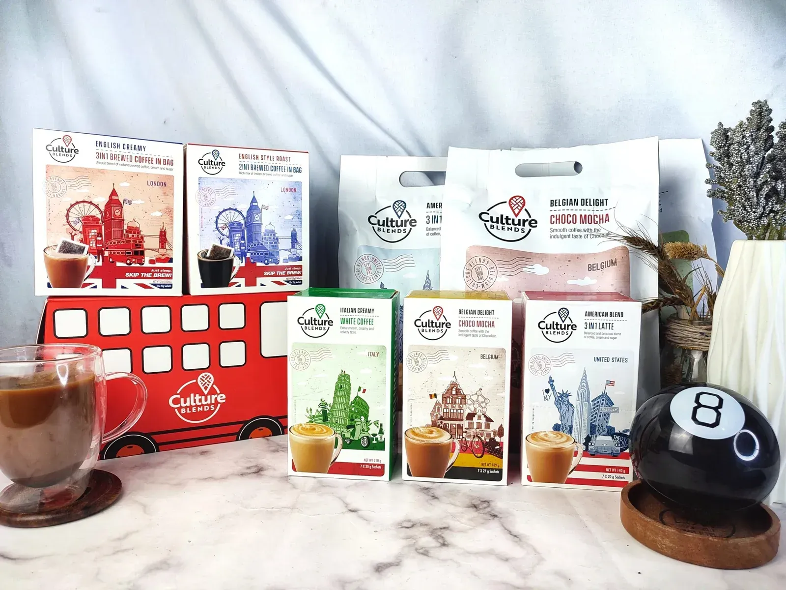 Display of Culture Brew coffee packs with a red bus and mug