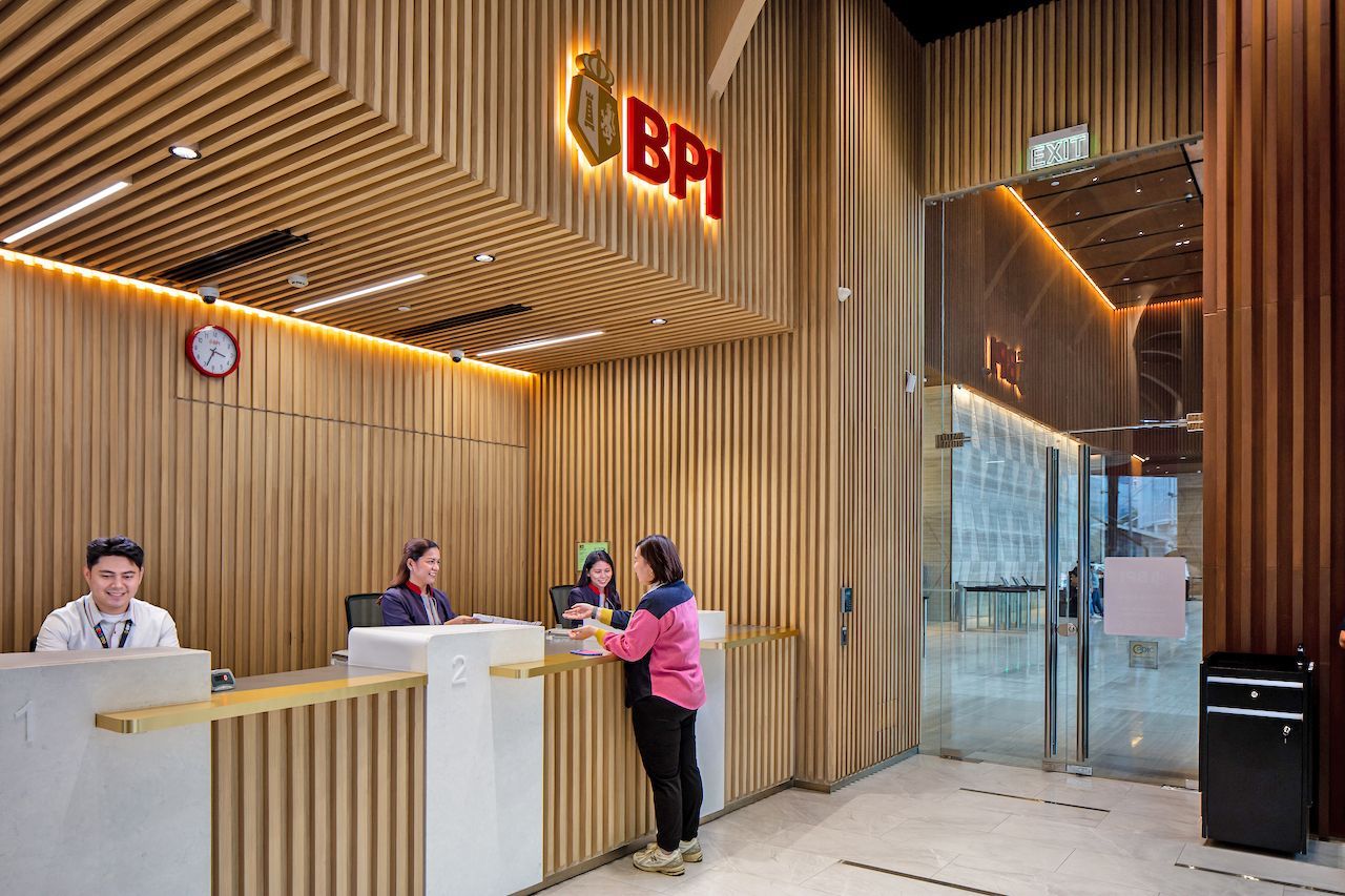 BPI bank branch interior with staff assisting customers at the counter