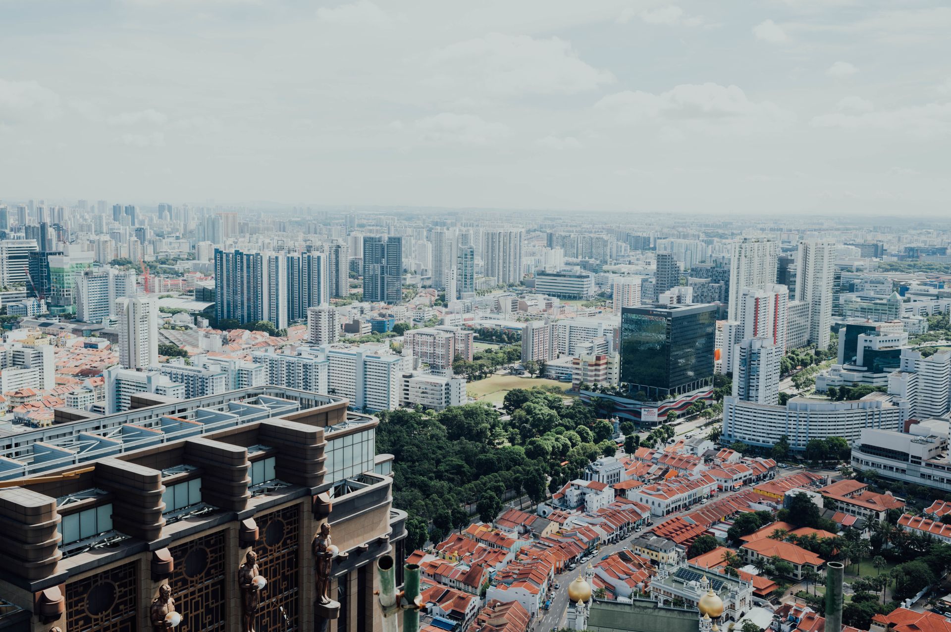 Aerial view of a dense city skyline with residential and commercial buildings