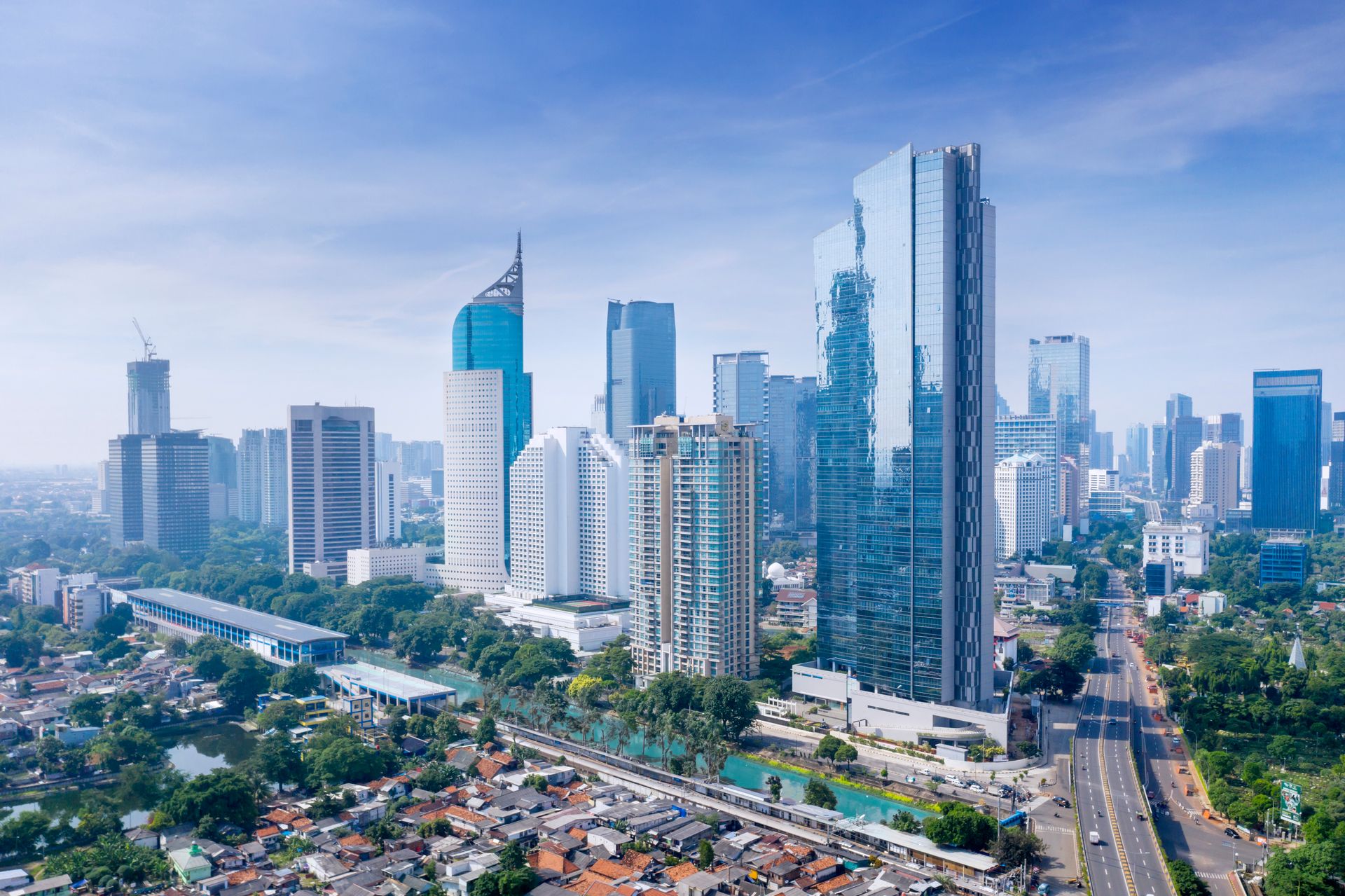 Aerial view of a dense city skyline with residential and commercial buildings