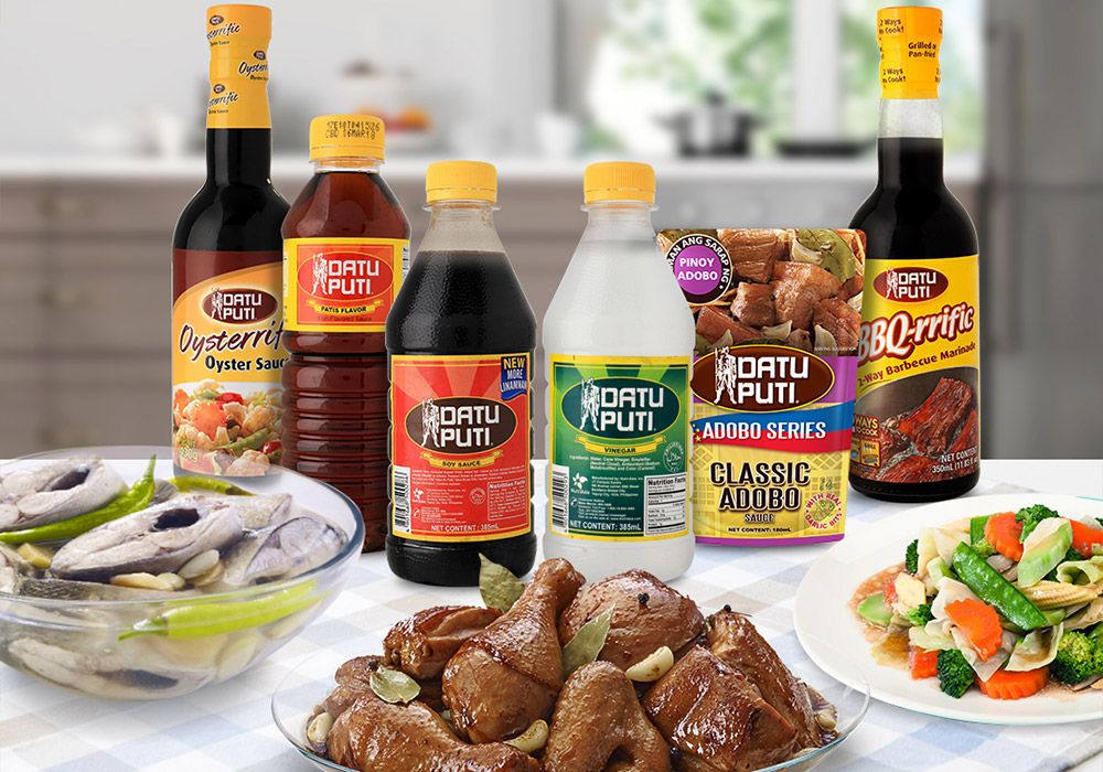 NutriAsia products arranged with cooked dishes on a table
