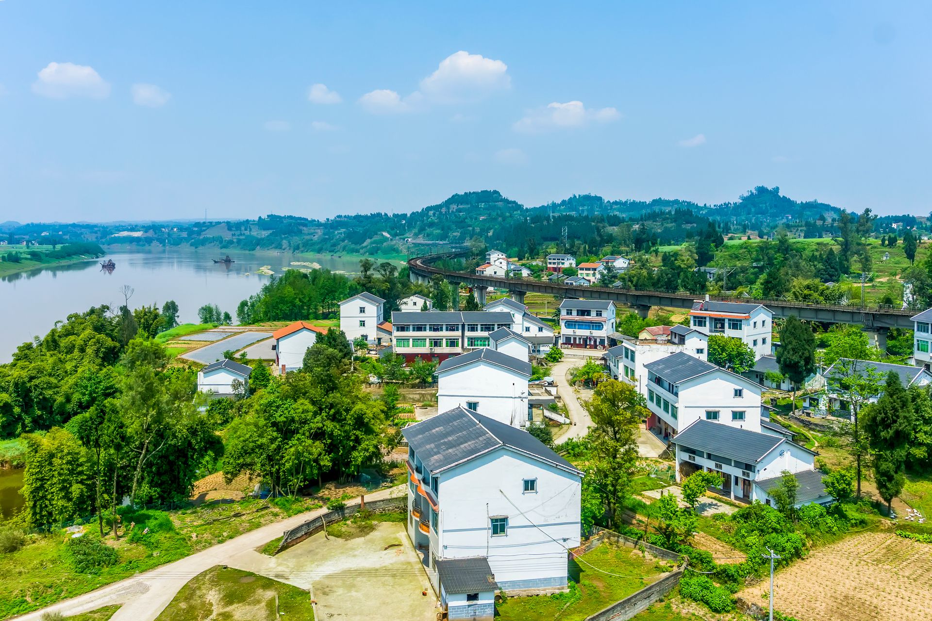 Two-story house in a new residential subdivision with people outside