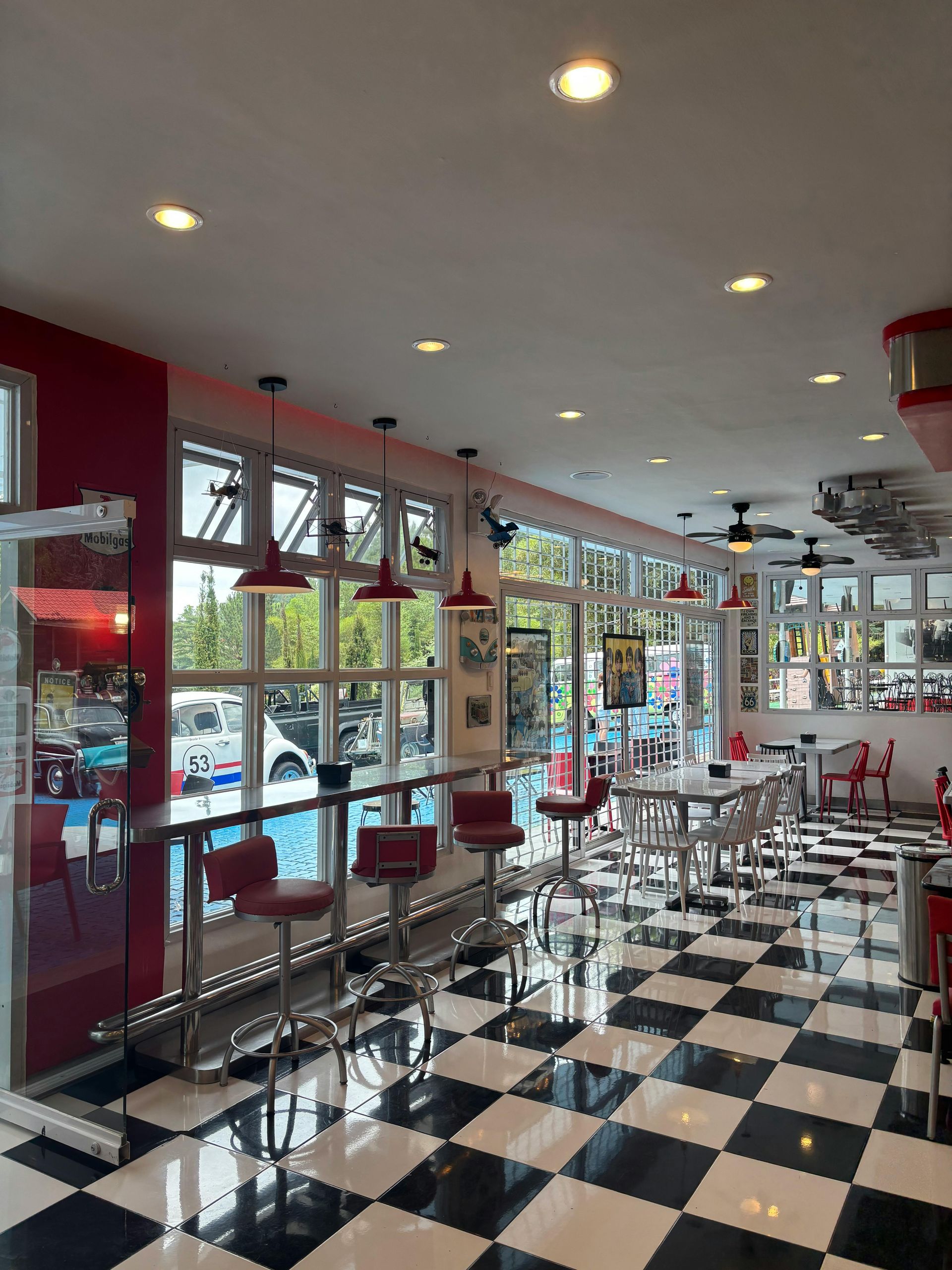 Cozy restaurant booth with blue seating and a koi wall mural