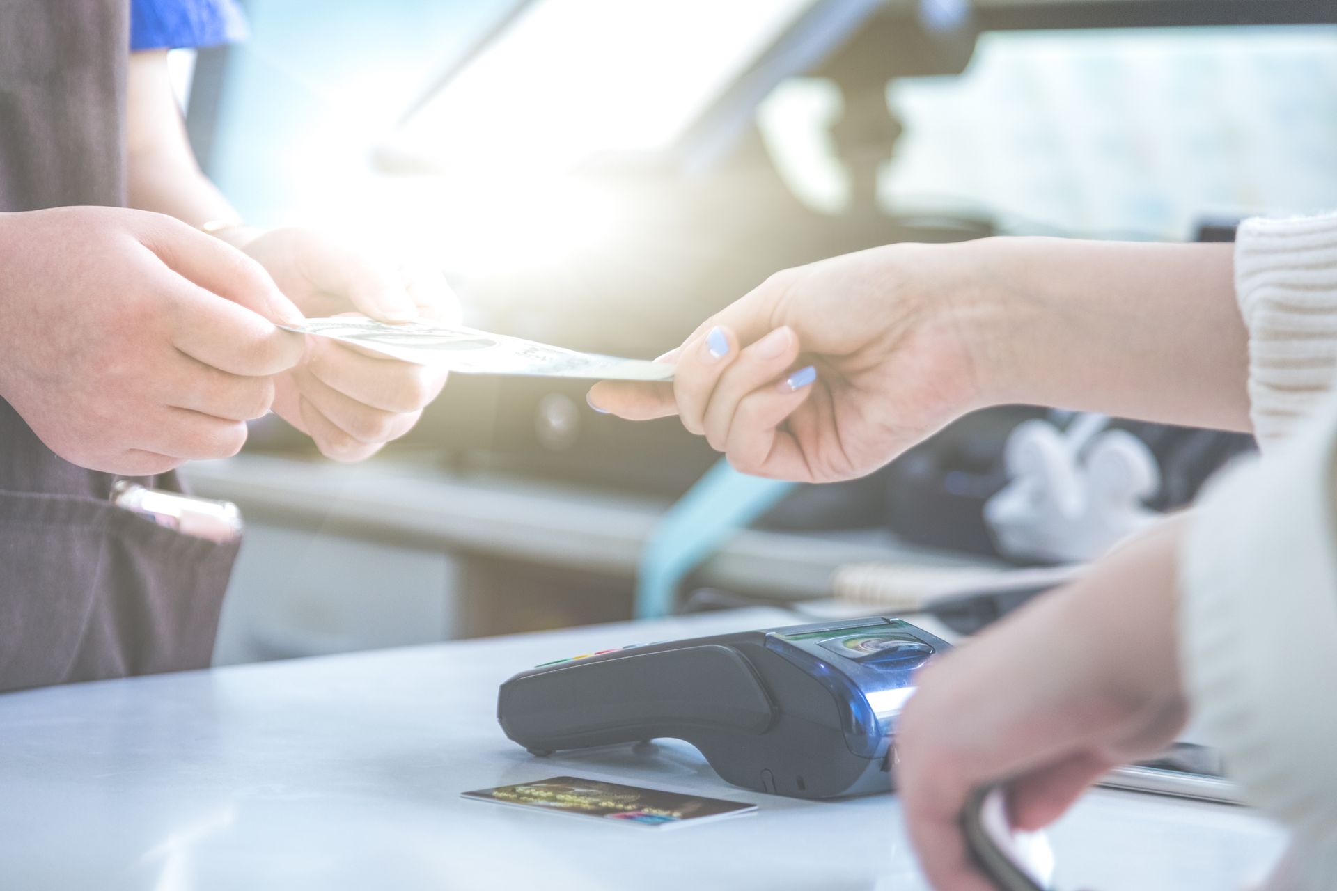 Woman holding a payment card and phone while shopping online