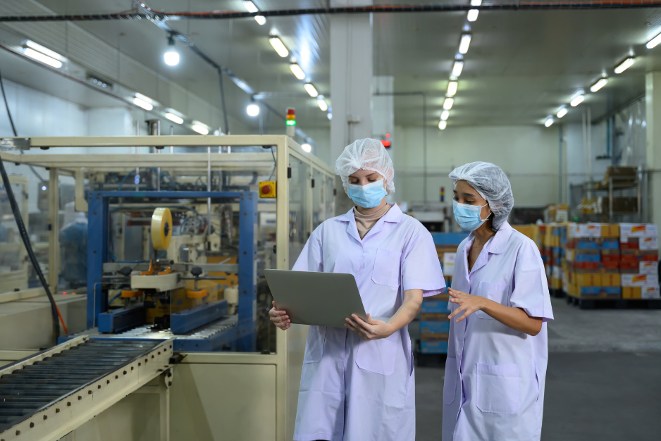 Automated packaging line moving products along a factory conveyor