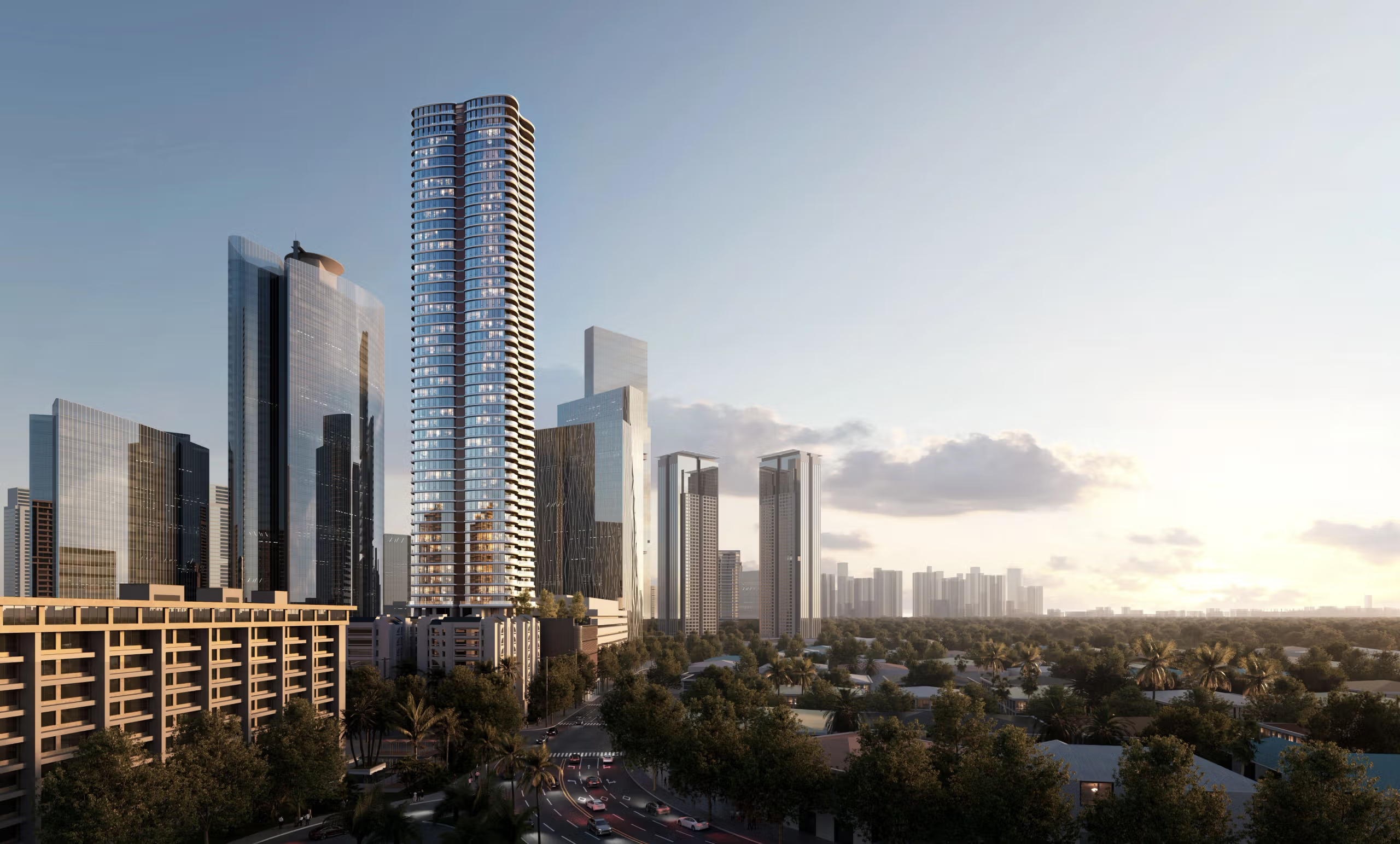Modern city skyline with a tall high-rise tower among skyscrapers at sunset, overlooking a tree-lined district